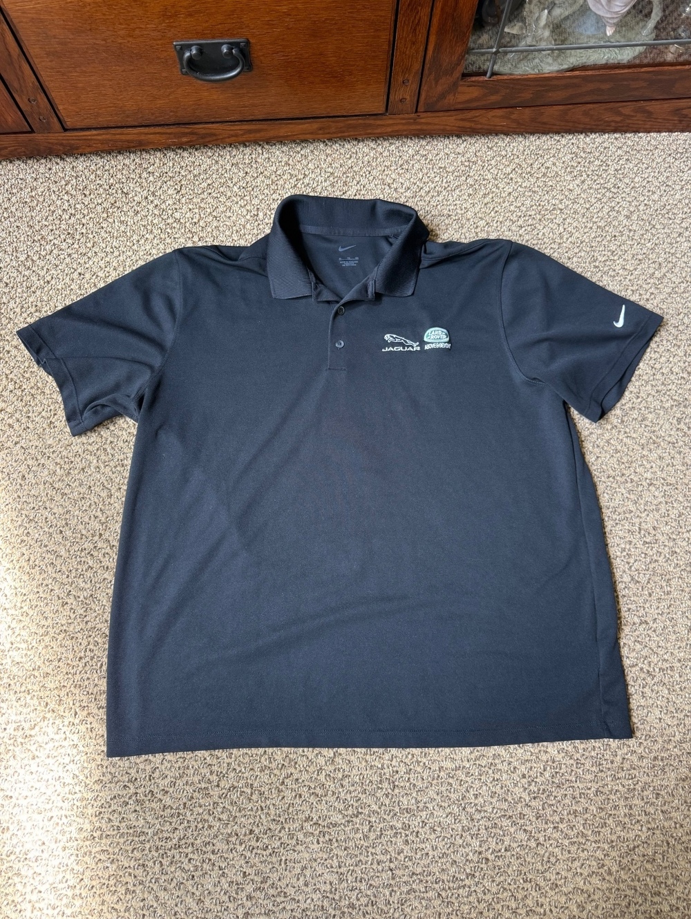 black Nike adri Fit gold polo with Jaguar and Land Rover logo